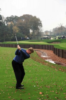 VIRGINIA WATER, ENGLAND - NOVEMBER 11:  Ernie Els of South Africa plays the first shots into the new water surrounded approach areas and 18th green on the West Course at the Wentworth Club, on November 11, 2009 in Virginia Water, England.  (Photo by David Cannon/Getty Images)