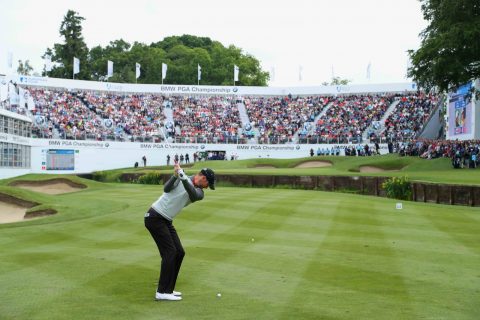 Wood plays his third shot to the 18th in front of packed grandstands at Wentworth