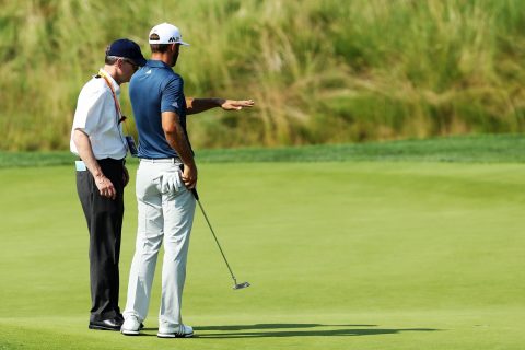 DJ with rules official on 5th green