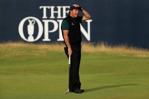 Mickelson reacts to his missed birdie attempt on the 18th hole that would have given him a 62