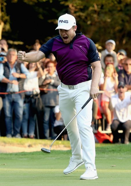 Hatton punches the air with delight after making a birdie at the final hole to win the Italian Open 