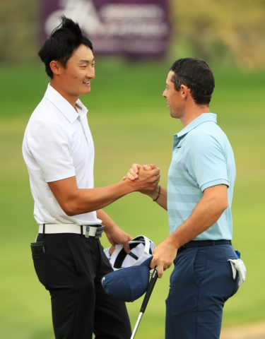 Hats off: Rory McIlroy congratulates Li Hooting at the final green