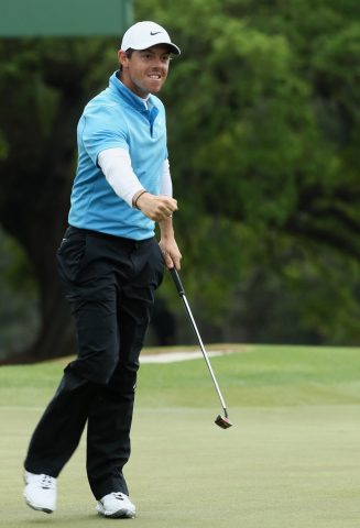 Rory McIlroy fired a third round 65 to close the gap on leader Patrick Reed to just three shots