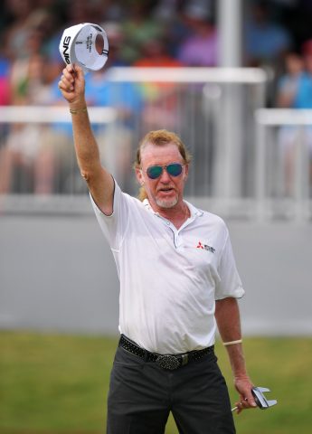 Jimenez acknowledges the crowd after securing his first major title on the senior circuit