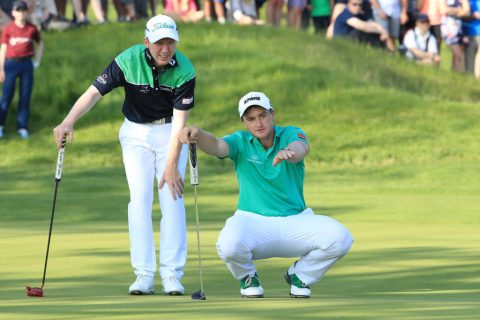 ST ALBANS, ENGLAND - MAY 06: Paul Dunne and Gavin Moynihan of Ireland (L) line up a putt during the final match during day two of the GolfSixes at The Centurion Club on May 6, 2018 in St Albans, England. (Photo by Andrew Redington/Getty Images)
