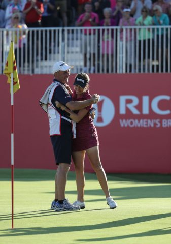Georgia Hall celebrates with her father Wayne, who also caddied for her 