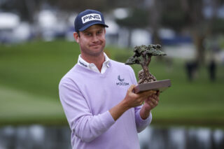 Harris English with the trophy after winning the Farmers Insurance Open at Torrey Pines (Photo by Sean M. Haffey/Getty Images)