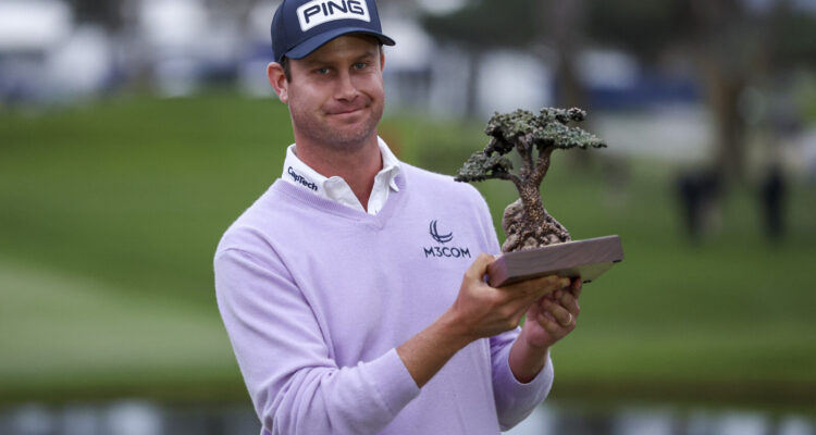 Harris English with the trophy after winning the Farmers Insurance Open at Torrey Pines (Photo by Sean M. Haffey/Getty Images)